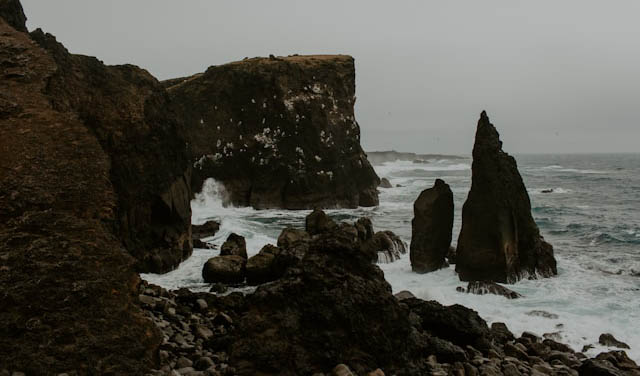 Rocky sea cliffs with crashing waves