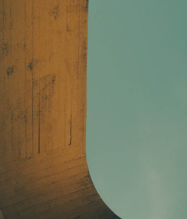 Concrete column edge against teal sky
